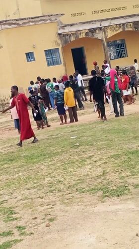 Community gathering at electrification project site in Akwanga