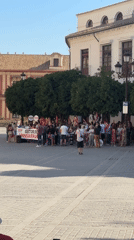 Labor protest and tourist activity converge in Seville's historic center