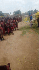 Snacks handed out to kids in school uniforms