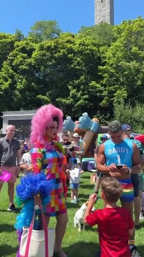 Drag performer takes the mic at sunny Provincetown outdoor event