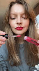 Woman applies Krystal Lips gloss in Izhevsk beauty moment