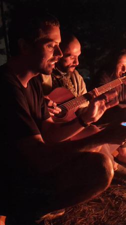 Nighttime campfire gathering with music in Lạc Dương, Vietnam