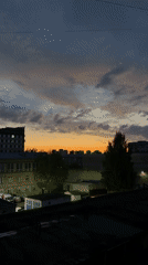 Dramatic sunset observed over Perm skyline amid heavy clouds