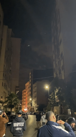 Fireworks and red flares light up Meknes streets at midnight