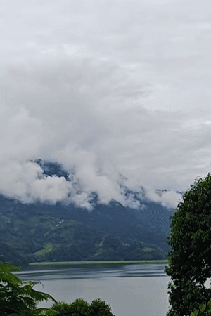 Phewa Lake under clouds, Pokhara hillside and city in view