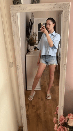 Woman takes mirror selfies with dog in Targovishte home