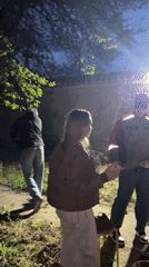 Young adults gather for outdoor evening social gathering in Chaikovsky