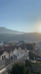 Morning sunlight illuminates Budva's terracotta rooftops and mountains