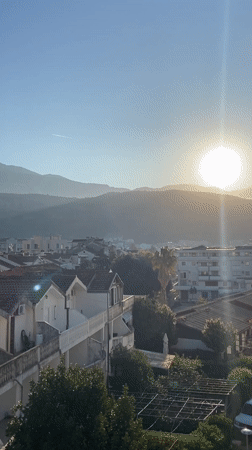 Morning sunlight illuminates Budva's terracotta rooftops and mountains