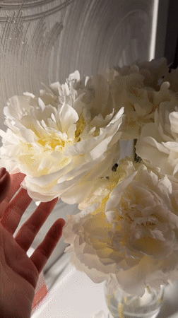 First birthday celebration with white peonies documented in Sochi