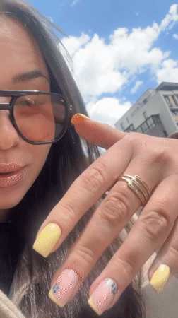 Woman shows off decorated yellow manicure in Varna