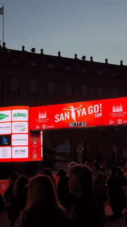 Santiago crowds watch marathon broadcast on outdoor screens