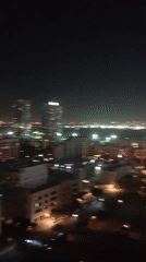 Dubai resident documents art collection and nighttime skyline views