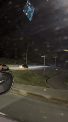 Nighttime traffic scenes recorded during snowfall in Ufa, Russia