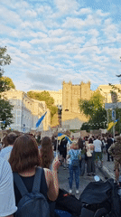 Protest crowd gathers in central Kyiv with Ukrainian flags