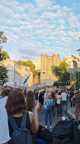 Protest crowd gathers in central Kyiv with Ukrainian flags