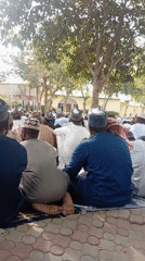Men gather outside mosque in Kano, Nigeria