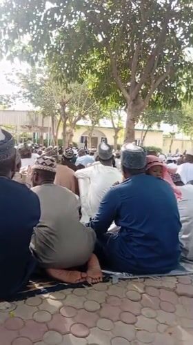 Men gather outside mosque in Kano, Nigeria