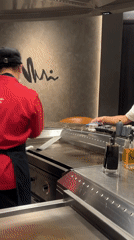 Teppanyaki dining experience captured at Japanese restaurant in Bangkok