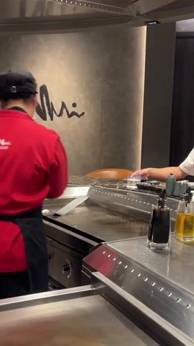 Teppanyaki dining experience captured at Japanese restaurant in Bangkok