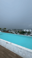 Rooftop pool captured during rainy morning in Choeng Thale
