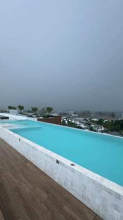 Rooftop pool captured during rainy morning in Choeng Thale