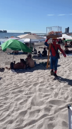 Spider-Man vendor serves beachgoers in Iquique, Chile