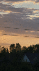 Woman photographed during golden sunset in rural Russia