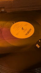 Vinyl record spinning on turntable captured in Cholula