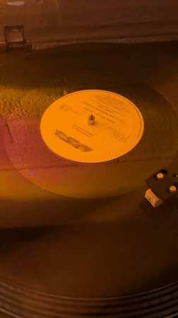 Vinyl record spinning on turntable captured in Cholula