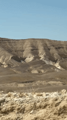 Layered desert mountains under clear skies in southern Israel