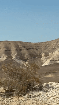 Layered desert mountains under clear skies in southern Israel