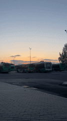 Evening bus depot scene captured at dusk in Kiryat Motzkin