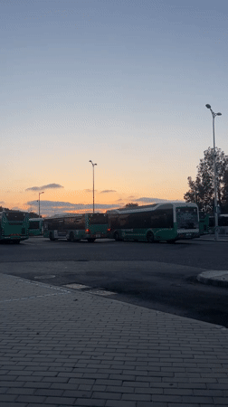 Evening bus depot scene captured at dusk in Kiryat Motzkin