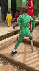 Children in tracksuits gather at building in Gura Top