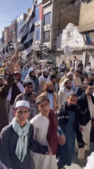 Religious procession with flags marches through Quetta streets