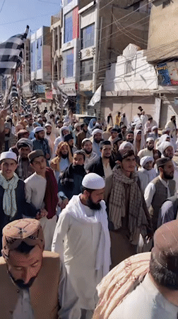 Religious procession with flags marches through Quetta streets