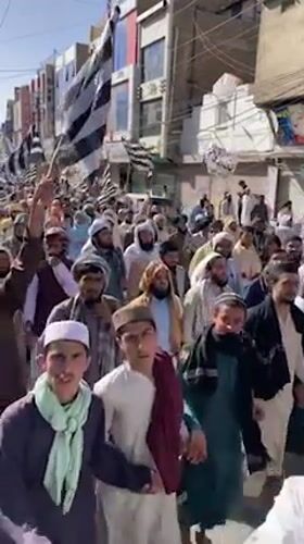 Religious procession with flags marches through Quetta streets