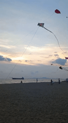 Sunset and kites captured at Pattaya beach