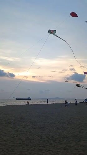 Sunset and kites captured at Pattaya beach