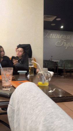 Young women socialize at cafe in Gabrovo, Bulgaria