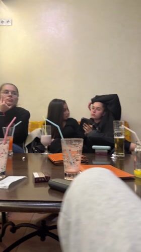 Young women socialize at cafe in Gabrovo, Bulgaria