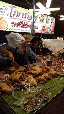 Night market stalls in Koh Phangan: roasted chicken and fried insects