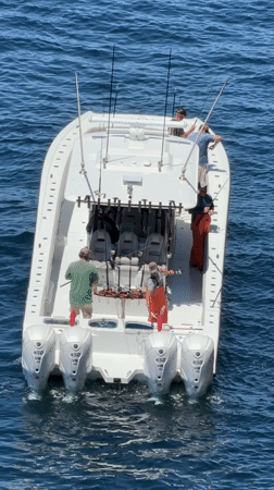 Fishing crew spotted on white motorboat in open waters
