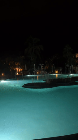 Night pool scene with fountains captured in Las Jarretaderas