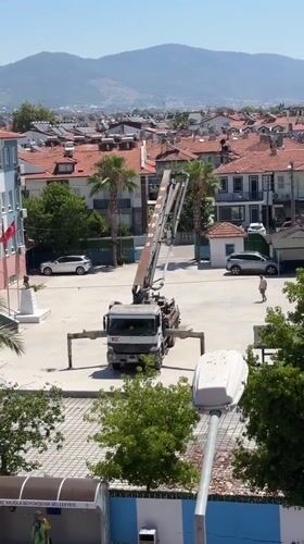 Crane and truck at a Fethiye construction site