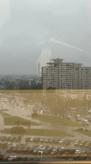 Rainy day captures: flooded parking lot and office workspace