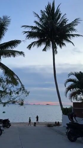 Dusk beach scene captured in Baan Sri Thanu, Thailand