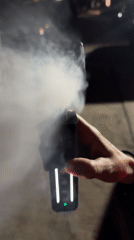 Person uses vapor-producing electronic device in Choeng Mon, Thailand
