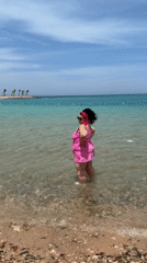 Woman enjoys morning beach time in Hurghada, Egypt